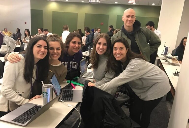 A group of smiling students from Meyers College of Nursing