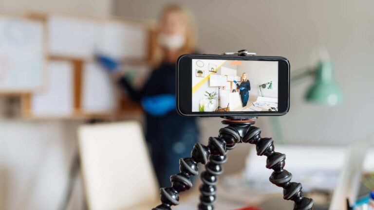 Cell phone mounted on a tripod for video recording